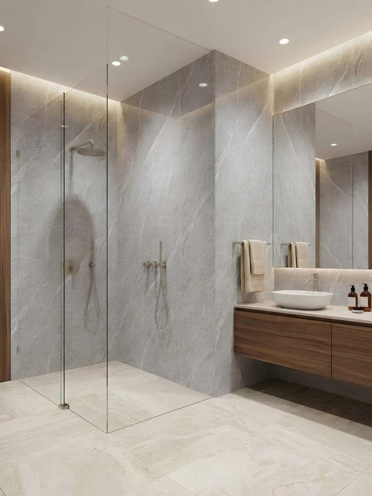 Ash gray marble PVC wall panels installed around a glass-enclosed shower and modern vanity