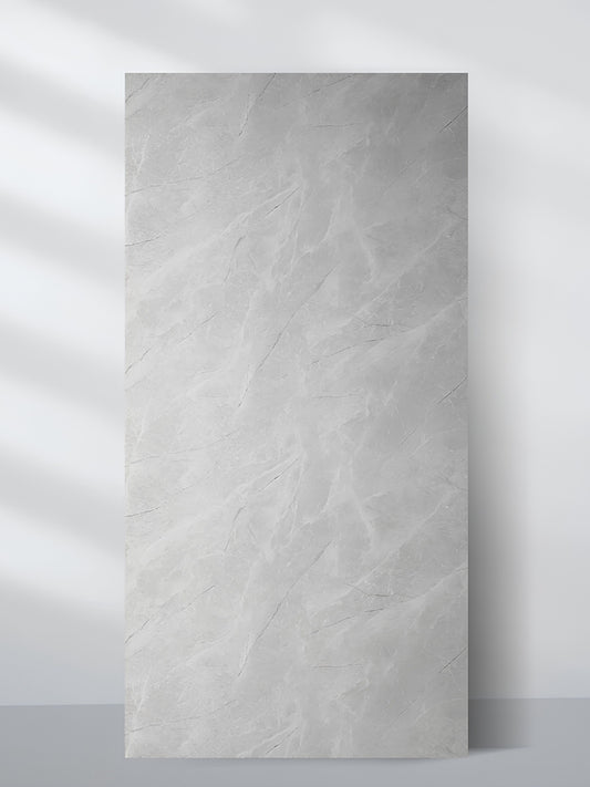 Serene Stone light gray marble-look PVC wall panel with subtle white veining, shown as a full 4 x 8 ft sheet