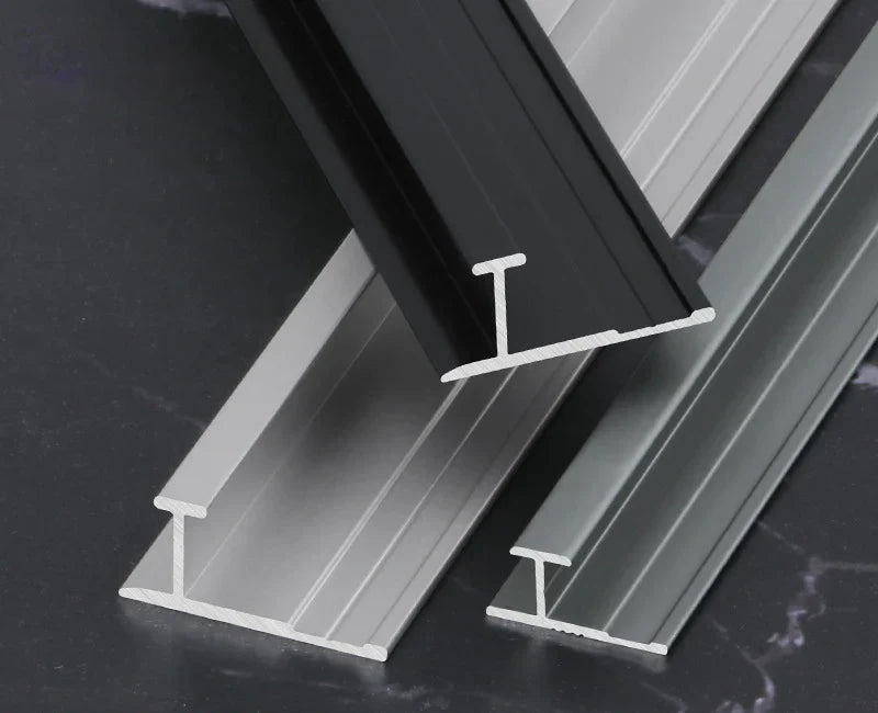 Aluminum wall panel H joint trim profiles in black, silver, and gray, durable metal connector strips for seamless wall panel joints and modern interior finishes