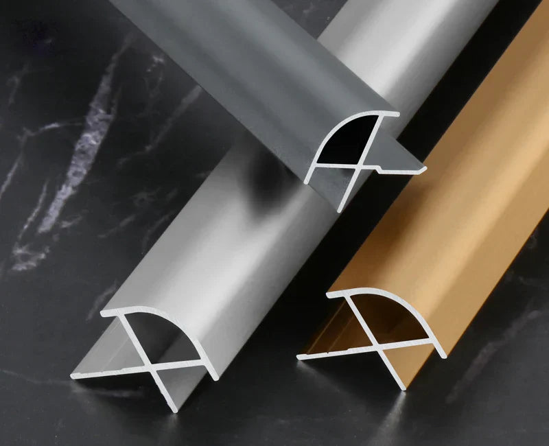 Aluminum wall panel outside corner trim profiles in black, silver, and gold finishes, showcasing durable metal edge strips for clean, modern wall panel corners