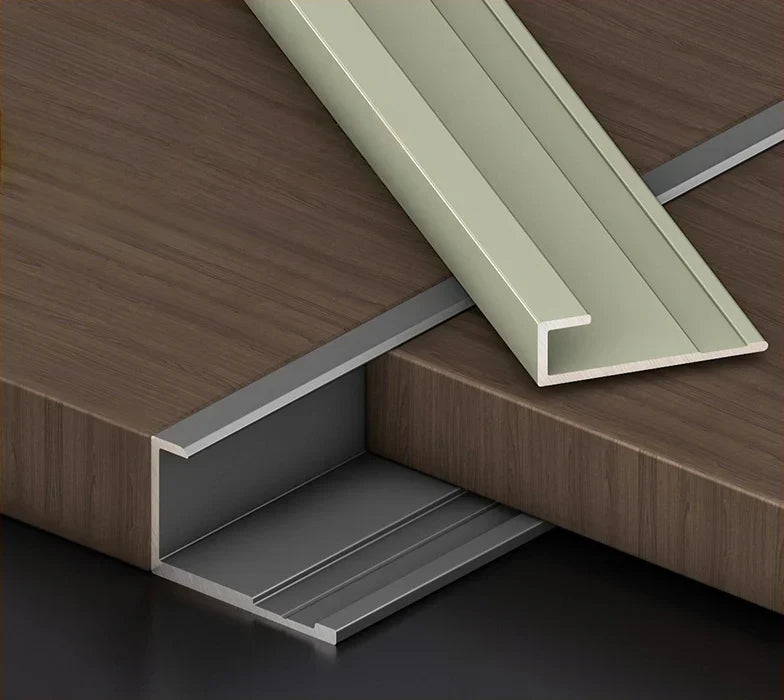 Aluminum wall panel trim end cap installed on wood wall panels, durable metal edge strip for clean panel finishing and modern interior design