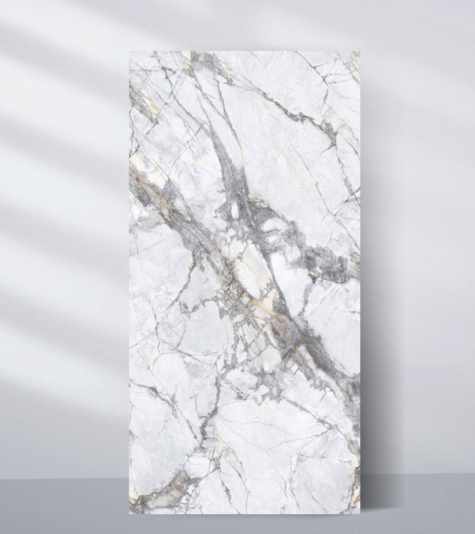 White PVC marble sheet sample with dramatic deep gray veins and fractured stone pattern