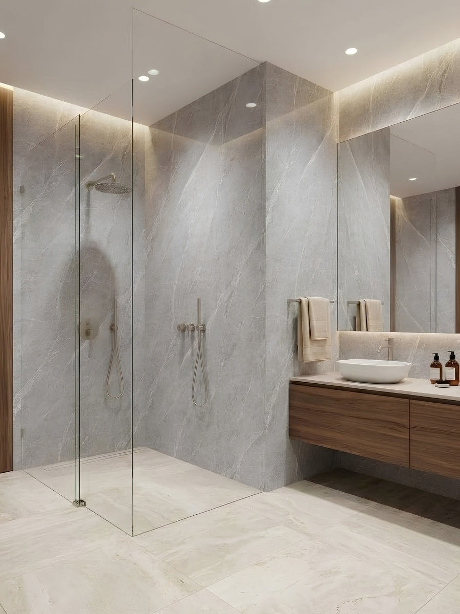 Ash gray marble PVC wall panels installed around a glass-enclosed shower and modern vanity