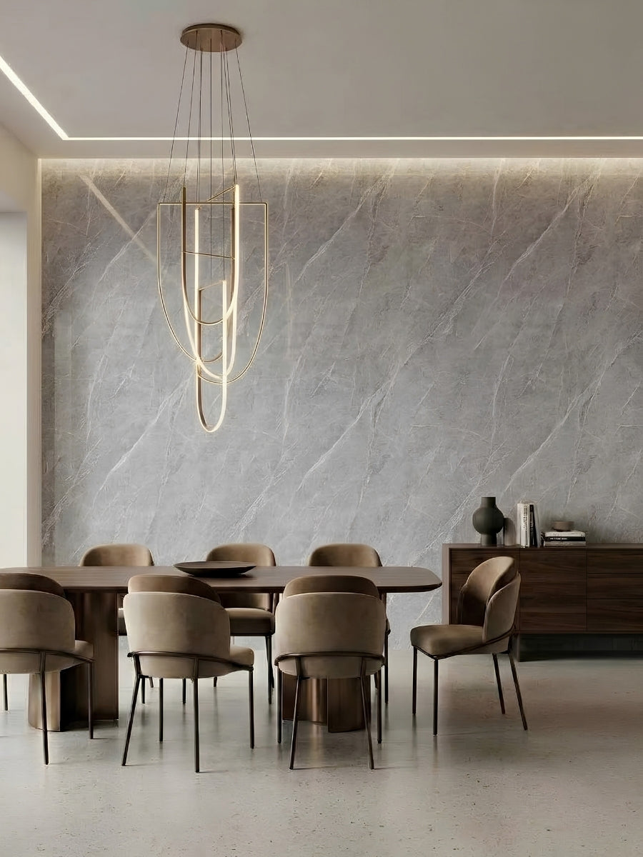 Dining room feature wall clad in ash gray marble PVC panels with subtle white veining