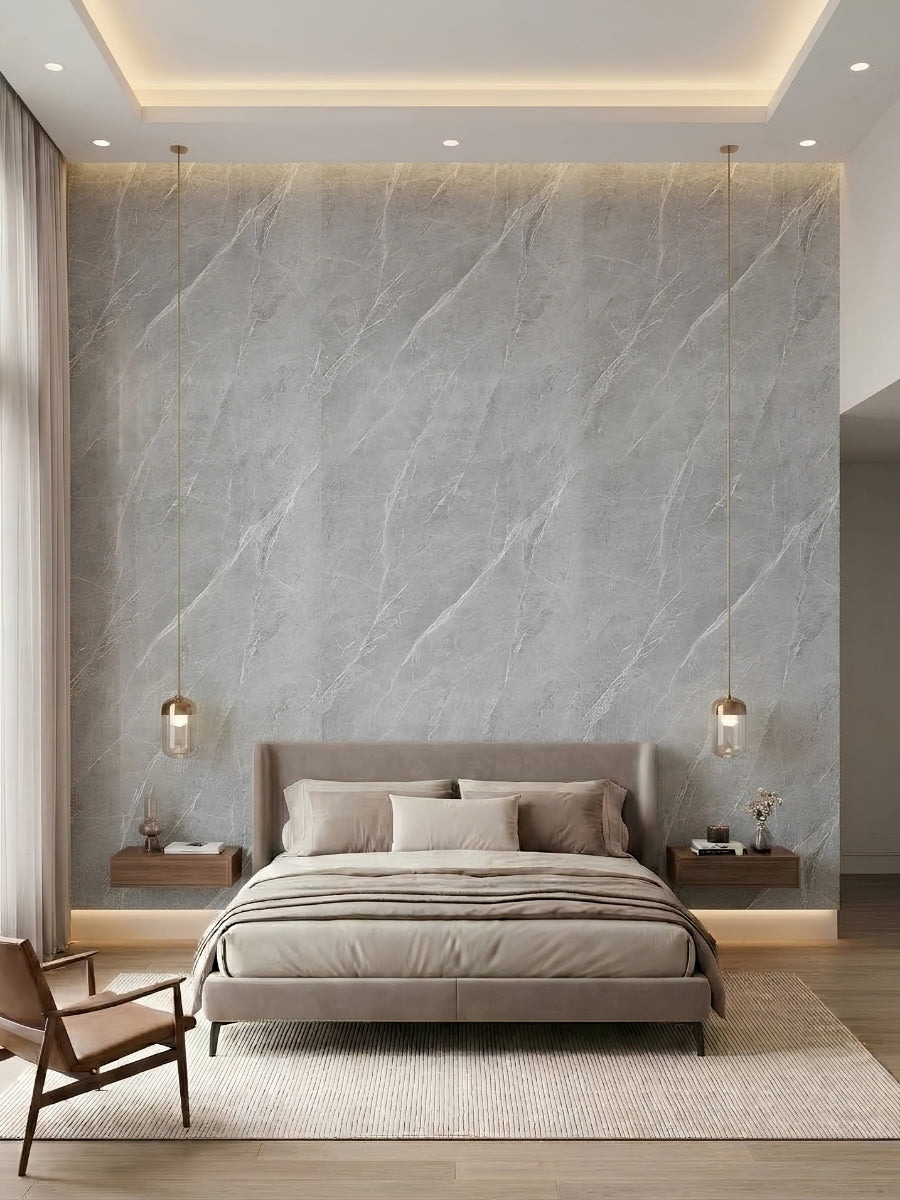 Ash gray marble PVC panel accent wall behind an upholstered bed in a modern bedroom
