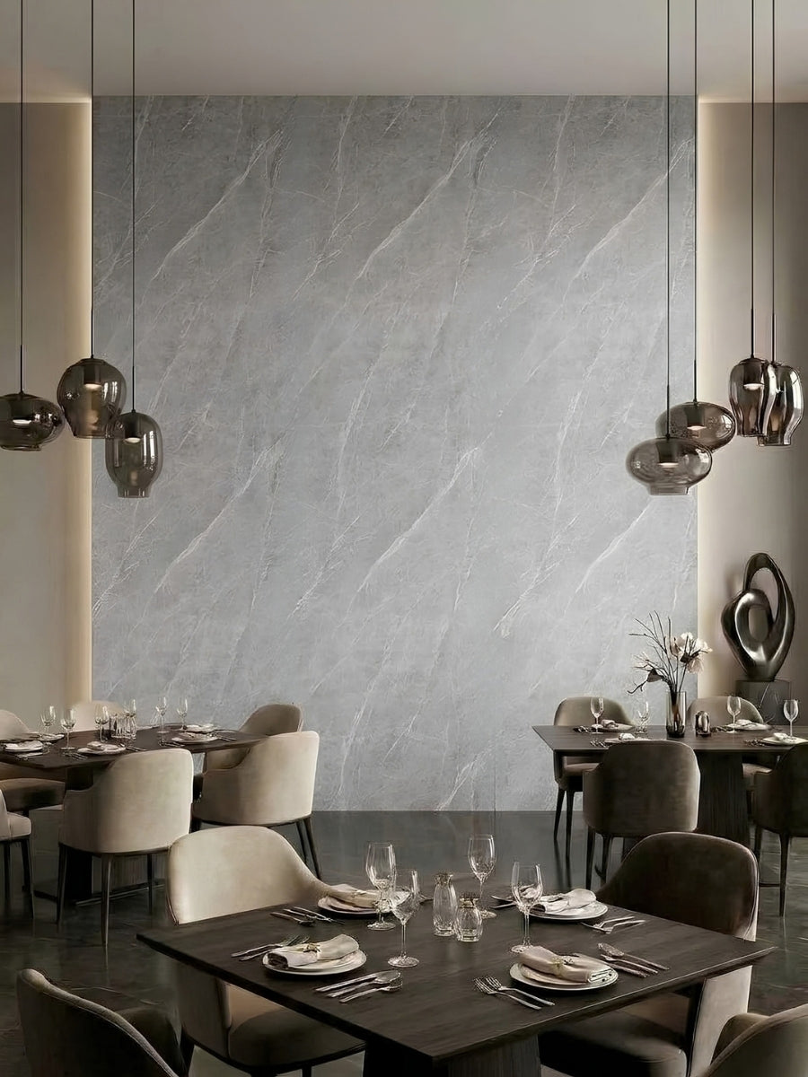 Modern restaurant dining area with an ash gray marble PVC panel feature wall