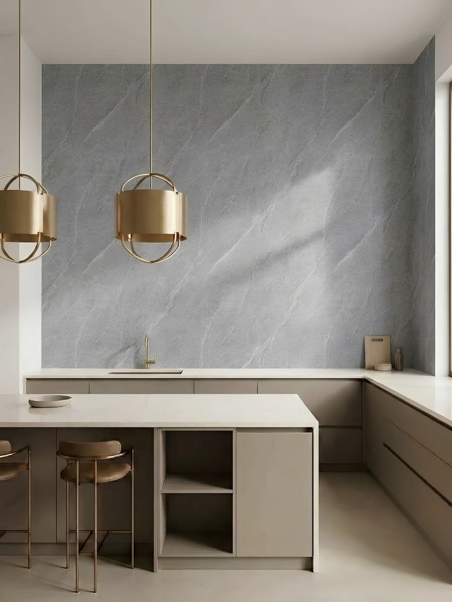 Modern kitchen with a full-height ash gray marble PVC panel wall above white counters