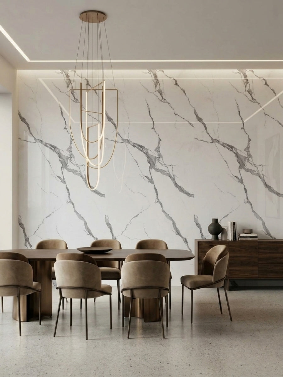 Dining room feature wall finished with white Calacatta Belga marble-look PVC panels and gray veining