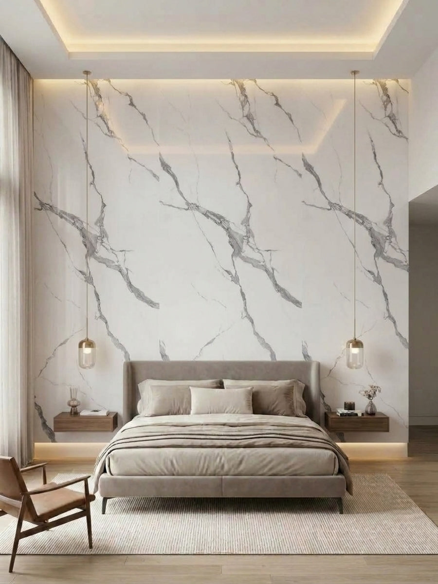 Calacatta Belga marble-look wall panels installed behind a modern upholstered bed