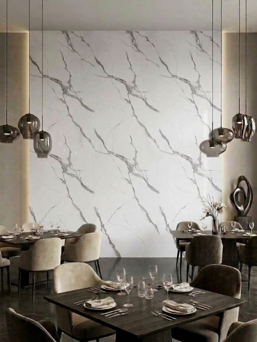 Restaurant dining area with a white and gray Calacatta Belga marble-look feature wall