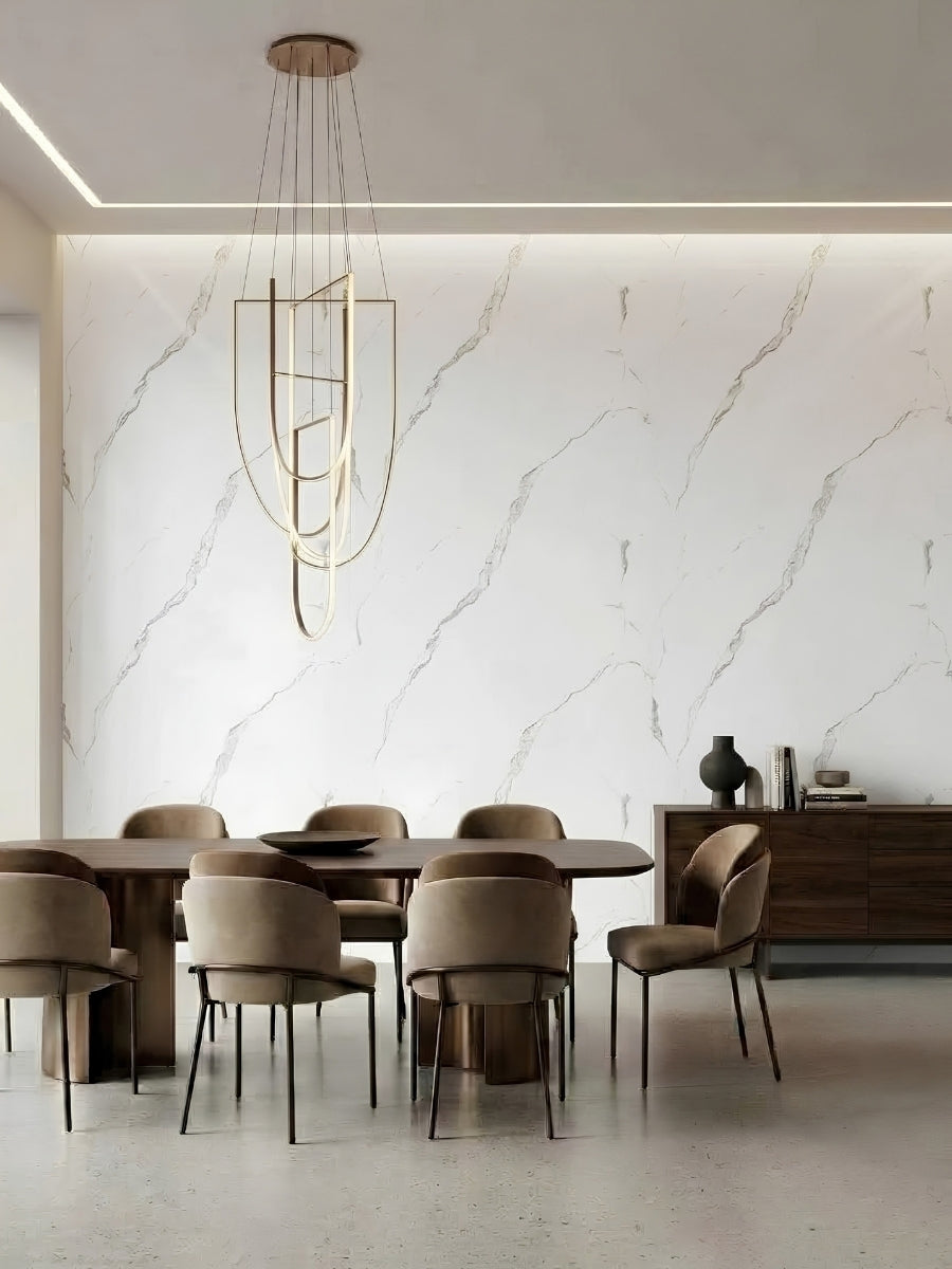 Modern dining room with a white Calacatta Manhattan marble-look paneled feature wall and gray veining