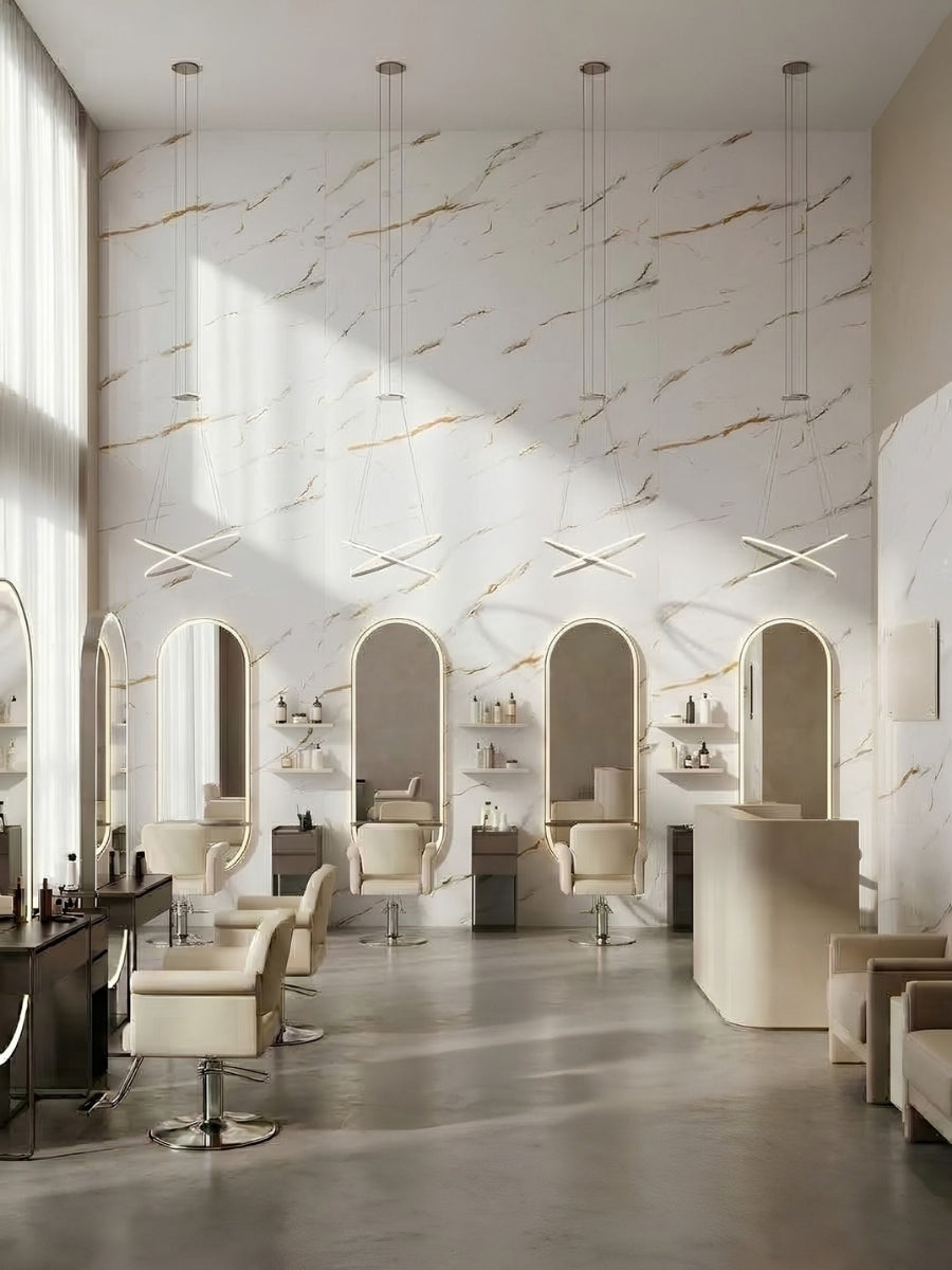 Bright salon interior with Caramel Vein PVC marble sheets covering the tall wall behind styling stations