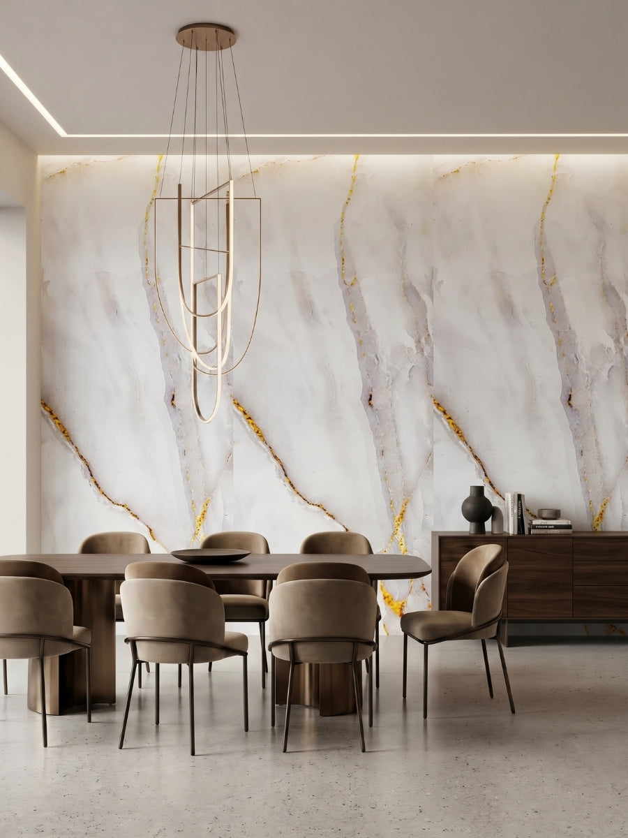 Dining room feature wall finished with Empress Gold polished PVC marble sheets in white, gray and gold veining