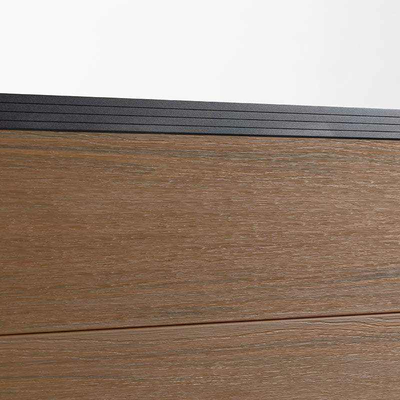 Brown walnut composite fence co-extrusion with sleek black metal railing, durable and stylish, available in NJ.