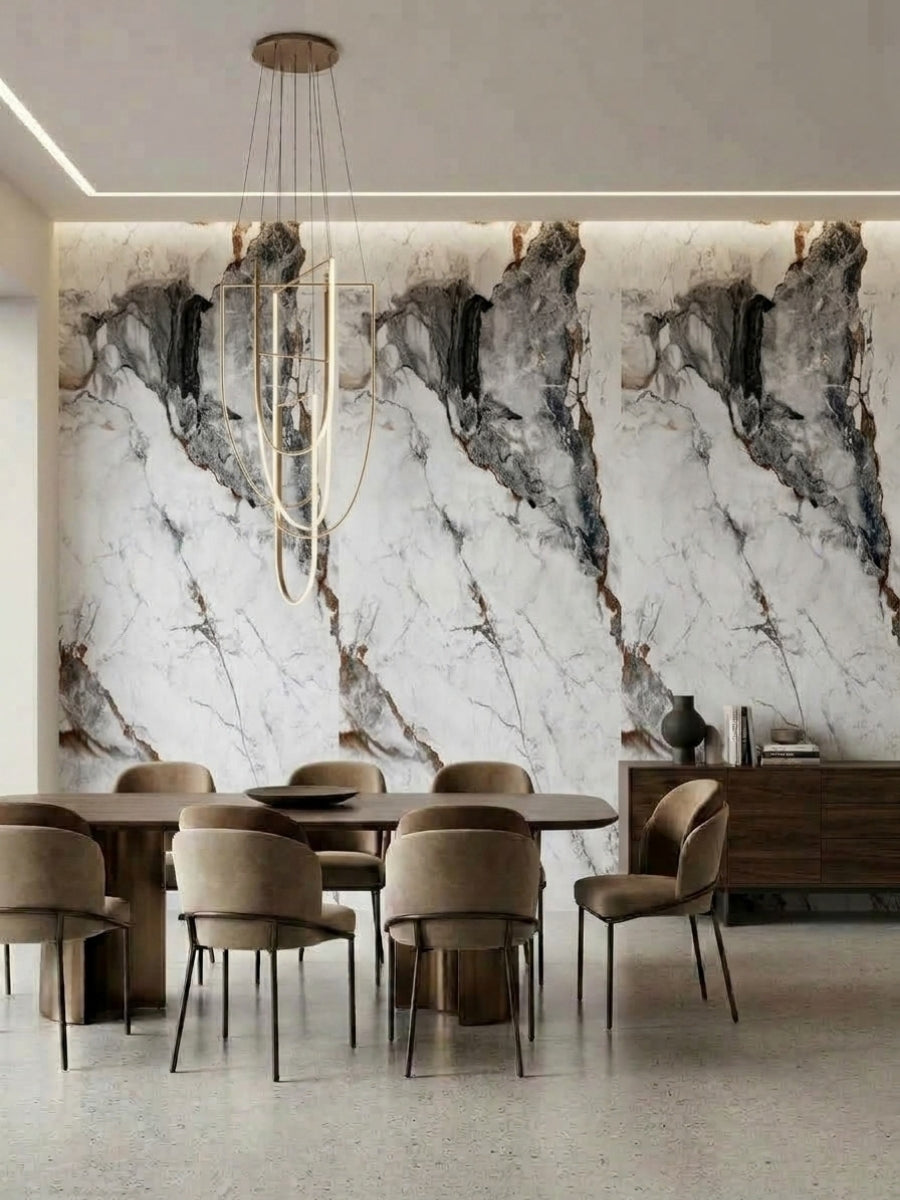 Marble-look PVC wall panels with bold gray and brown veining behind a contemporary dining table