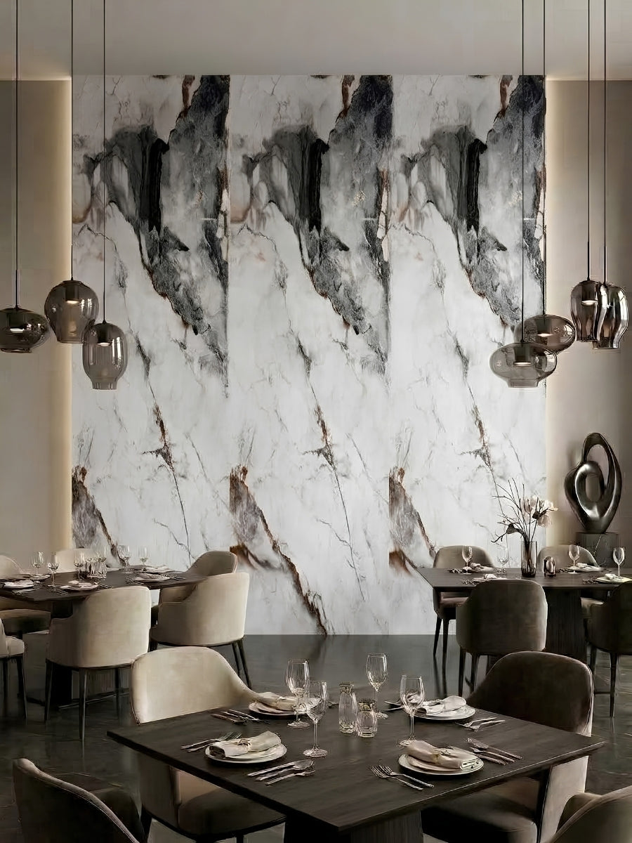 Restaurant dining area with a tall marble-look PVC panel feature wall in white, gray, and brown