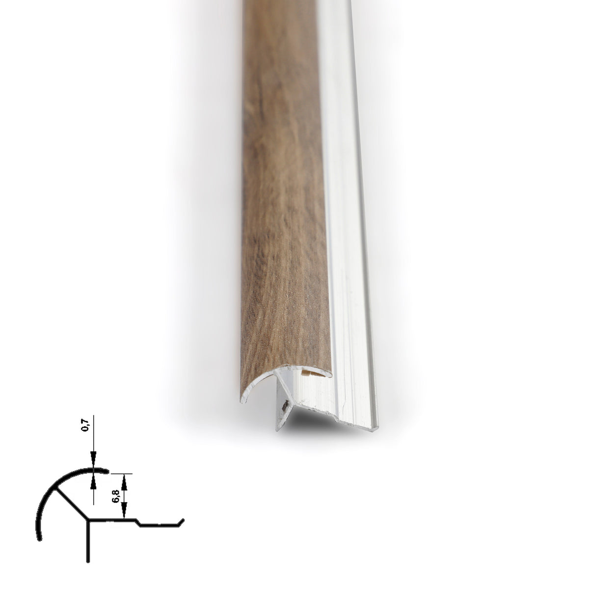 Close-up of weathered brown 6.3mm aluminum corner trim showing the silver mounting profile