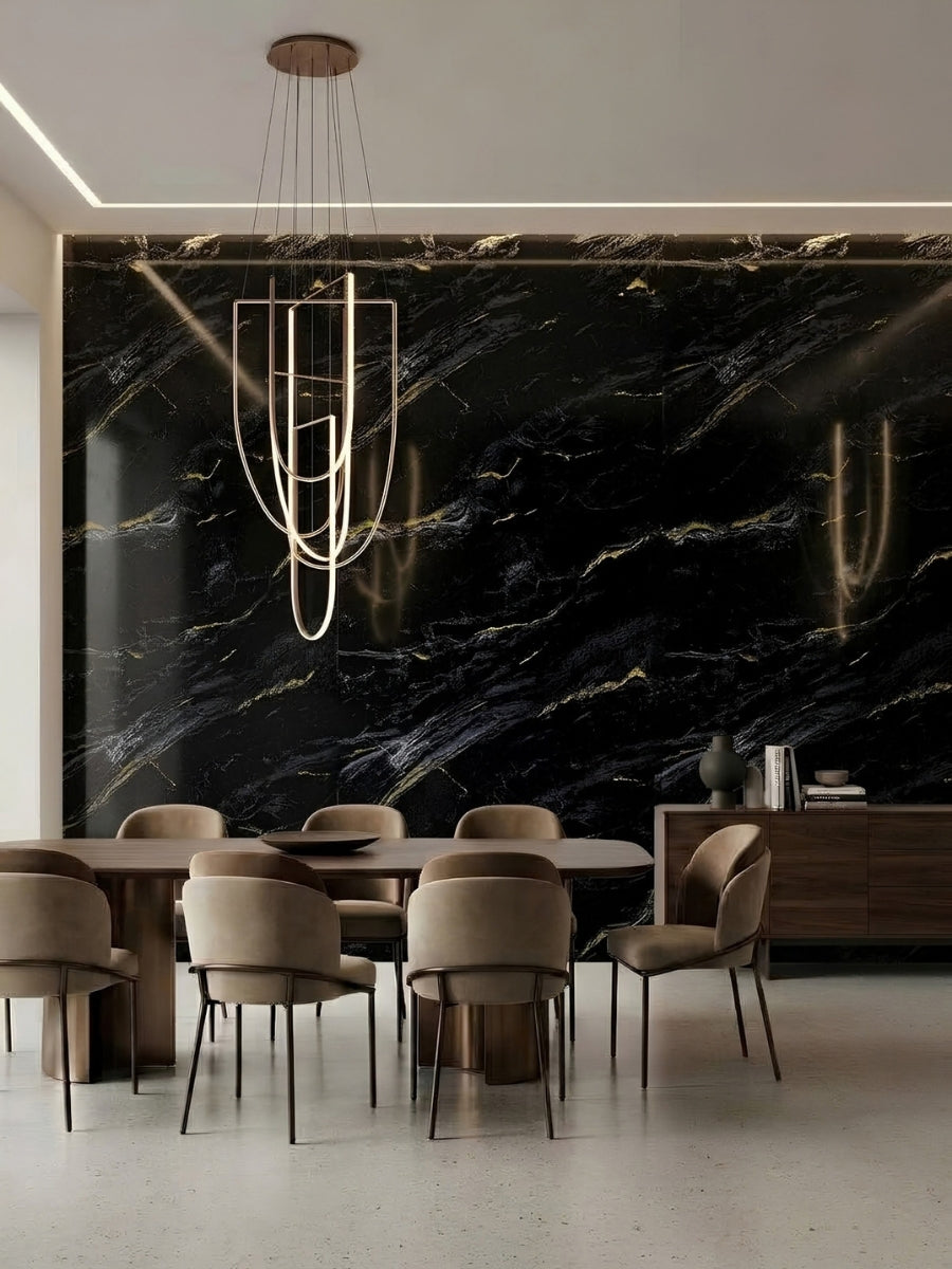 Modern dining room with Midnight Gold Marble PVC wall panels installed behind the table and chandelier