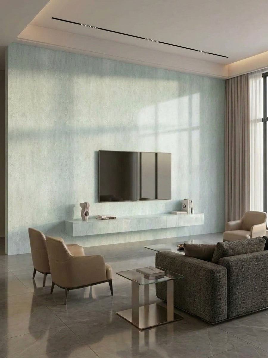 Pale green travertine-look PVC panels covering a contemporary living room media wall