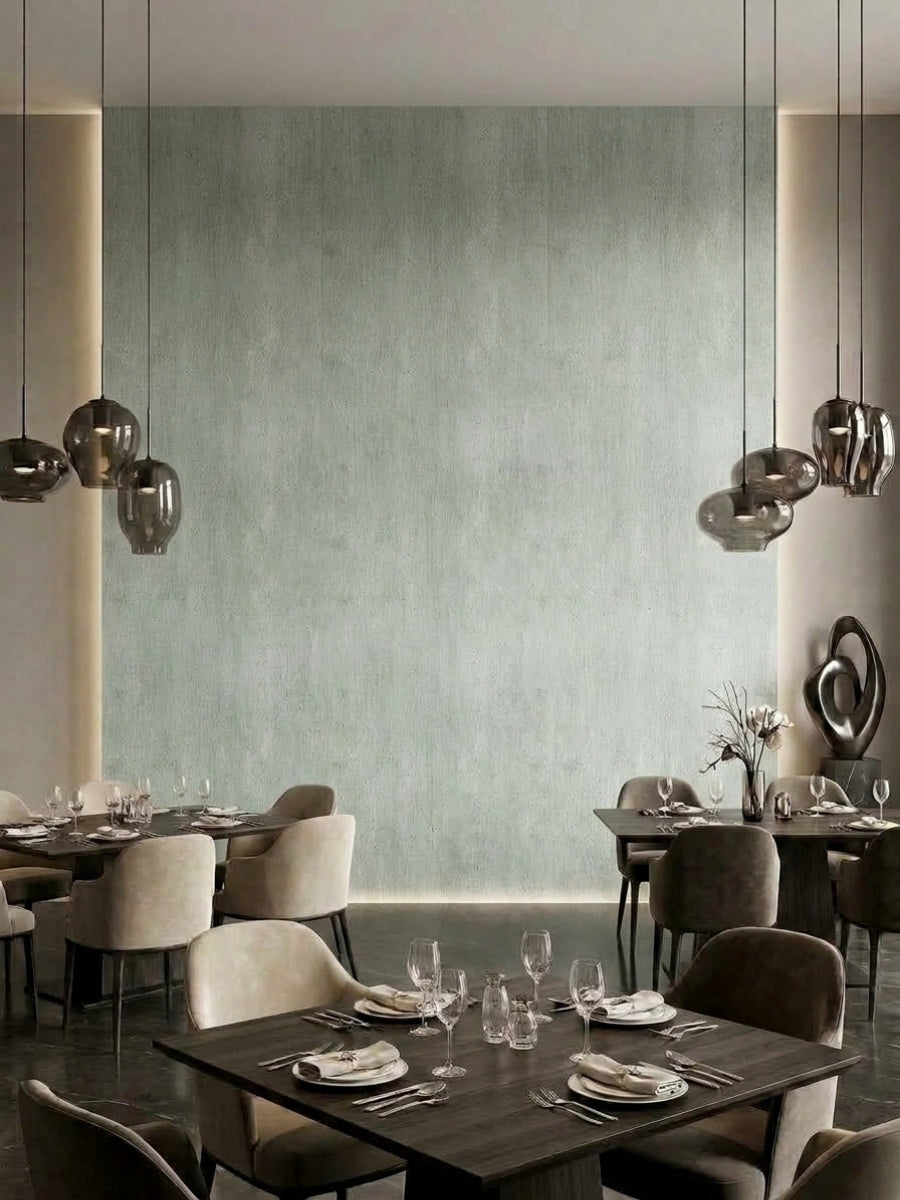 Pale green travertine-look PVC panel feature wall in a contemporary restaurant dining area