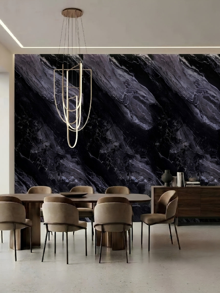 Dining room feature wall finished with black Noir Vein Marble panels and dramatic gray-violet veining