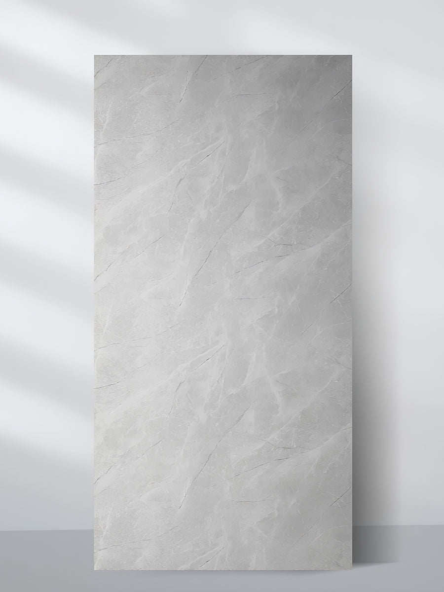 Serene Stone light gray marble-look PVC wall panel with subtle white veining, shown as a full 4 x 8 ft sheet