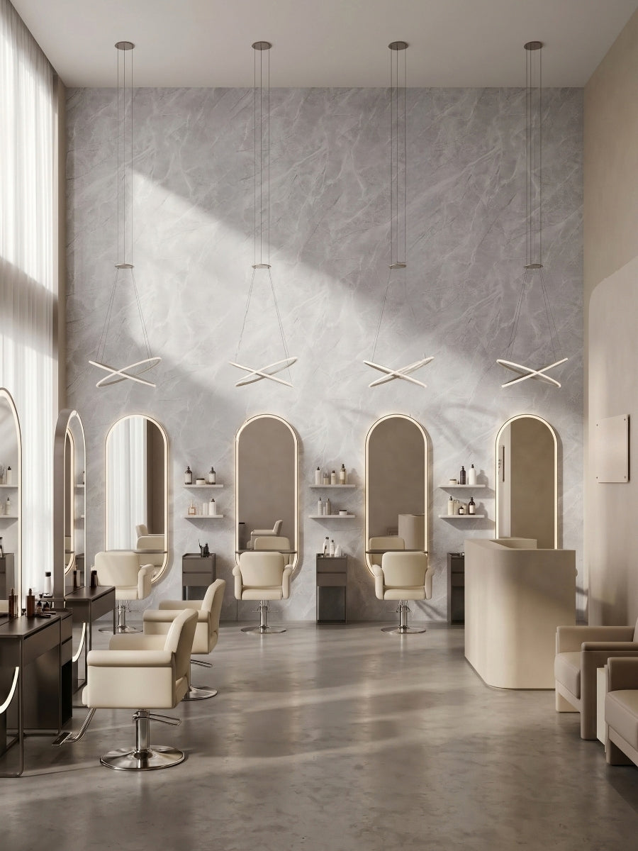 Serene Stone gray marble-look PVC panels covering a tall salon wall with arched mirrors and styling chairs
