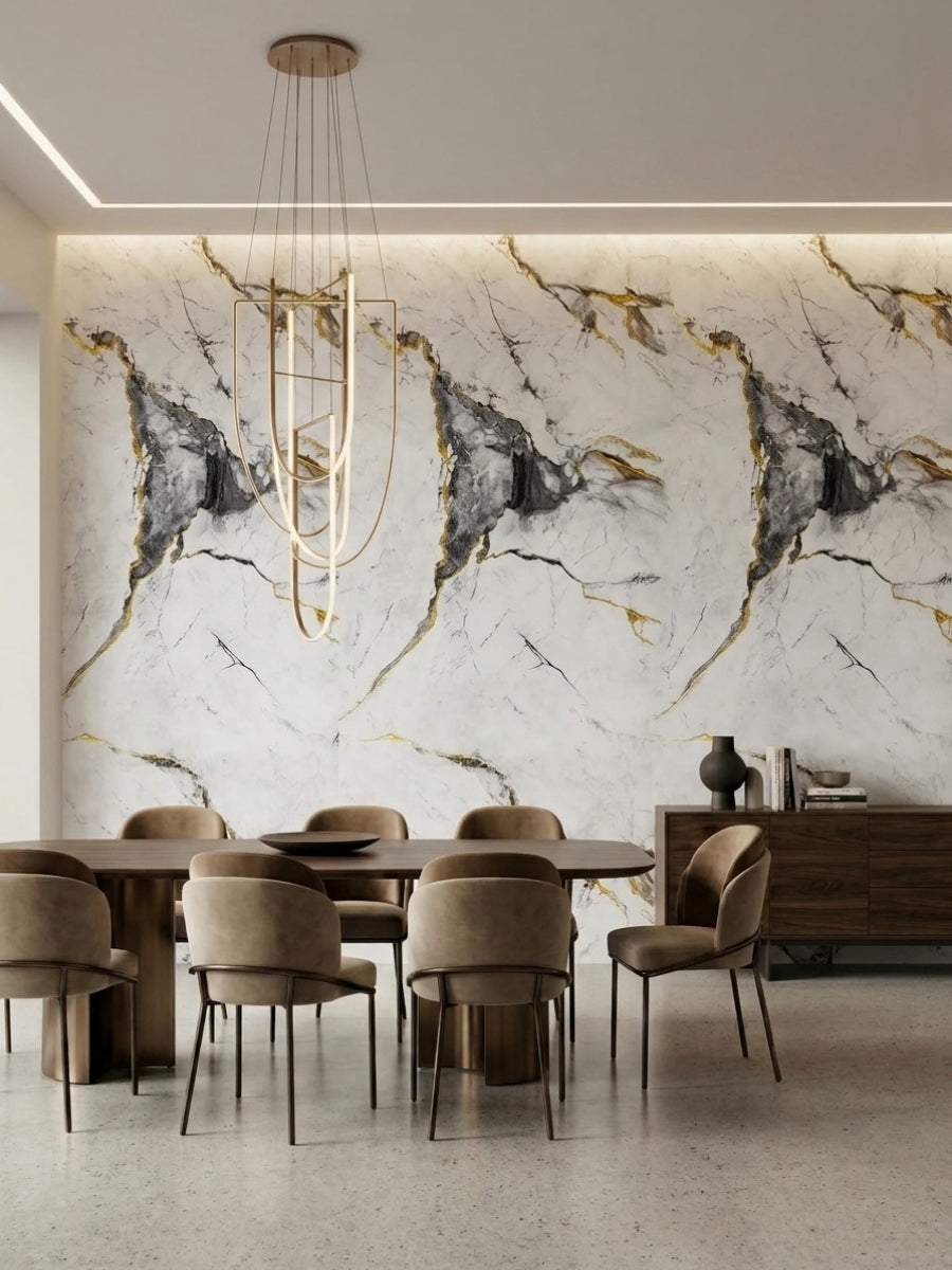 Marble-look PVC wall panels with deep gray and gold veining installed behind a modern dining table