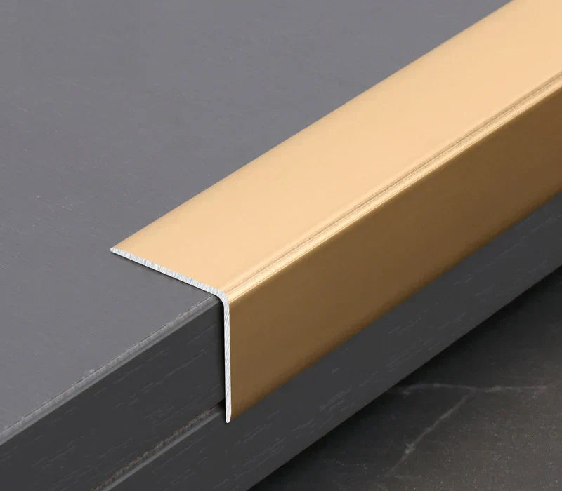 Gold aluminum wall panel L cap trim installed on panel edge, delivering a clean finished edge and durable protection for modern interior wall panel installations